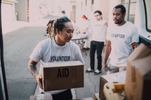 Community meal service volunteers helping families